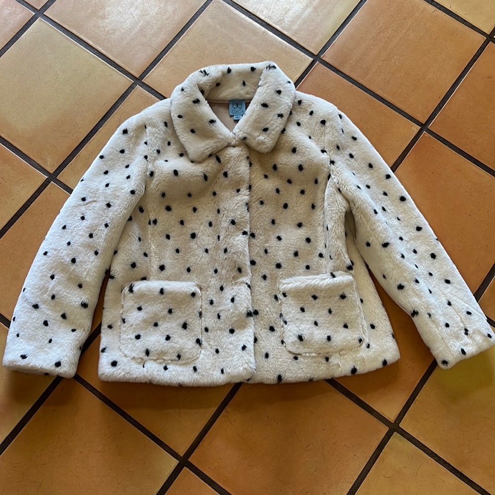 White fur jacket and black dots
